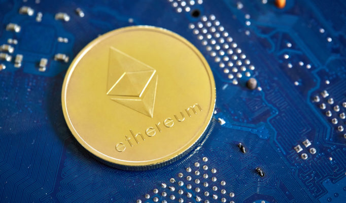 Golden,Ethereum,Coin,Cryptocurrency,On,A,Computer,Mainboard,,Selective,Focus,