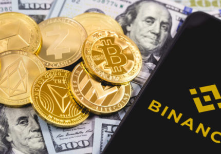 Apple,Iphone,And,Binance,Logo,,And,Dollars,With,Cryptocurrency.,Binance